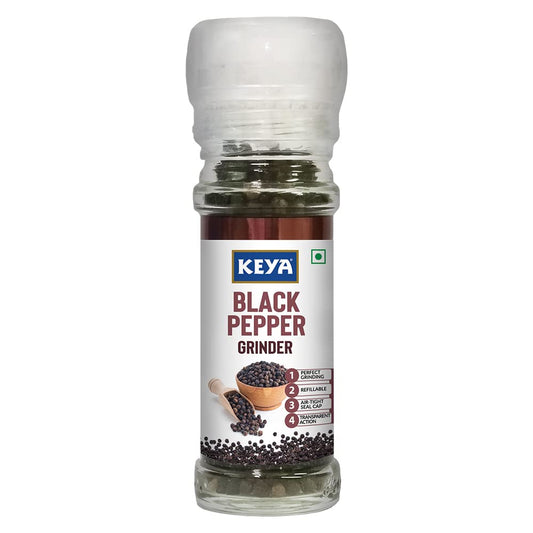 Keya Black Pepper Grinder with fresh black peppercorns, showing freshly ground pepper on a dish. - Image 2