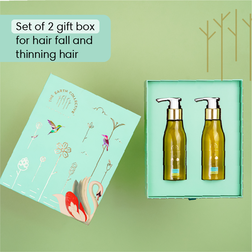 The Earth Collective Volumizing Blend gift box for weak and thinning hair, featuring cleanser and conditioner bottles.