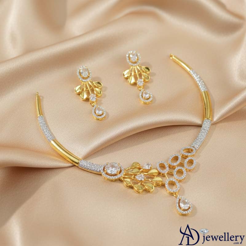 Matching teardrop earrings with gold-tone floral accents