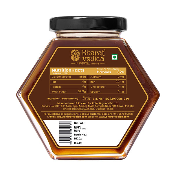Bharat Vedica Forest Honey in a signature hexagon bottle, showcasing its deep amber color on a natural background. - Image 4