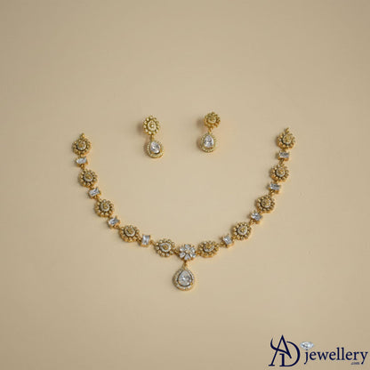 Detailed view of the sparkling stone embellishments on the necklace.