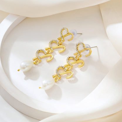 Joker and Witch Aria Monogram Gold Earring