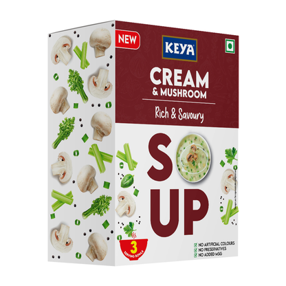 Keyafoods Keya Cream and Mushroom Soup packet next to a bowl of creamy mushroom soup garnished with herbs. - Image 2