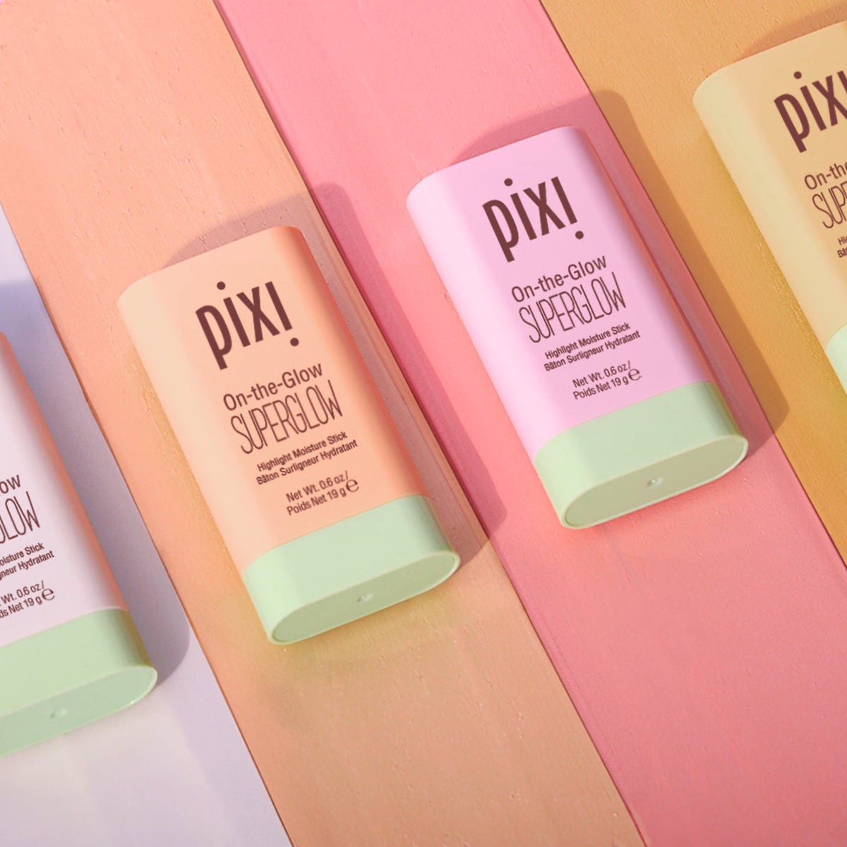 Pixi Beauty SuperGlow Collection skincare products arranged for a dewy complexion.