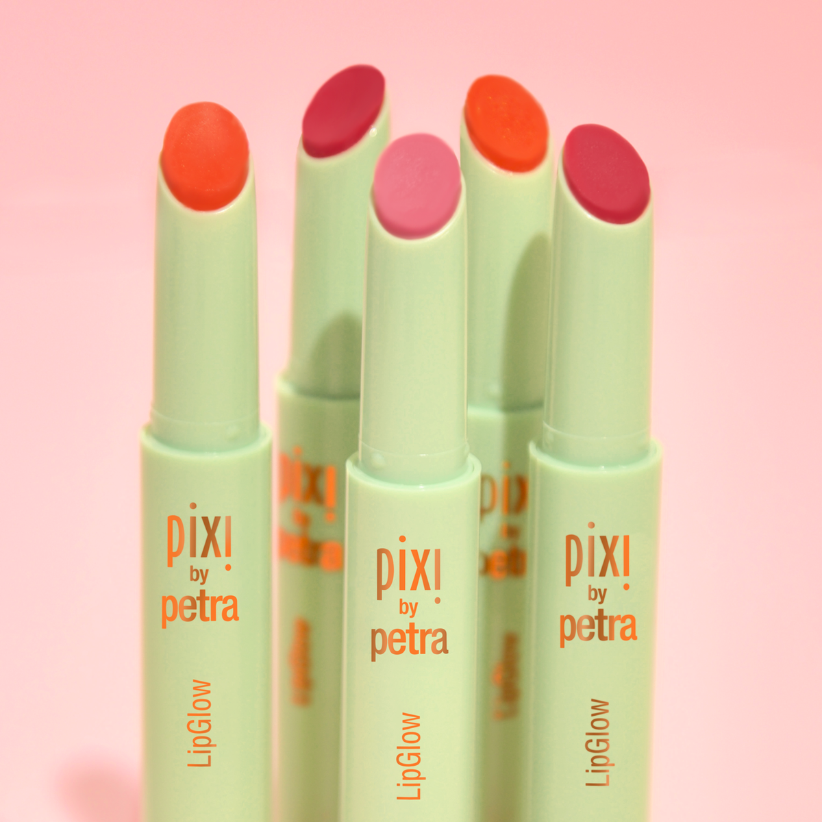 Artistic shot of Pixi LipGlow, highlighting its subtle tint and glow.