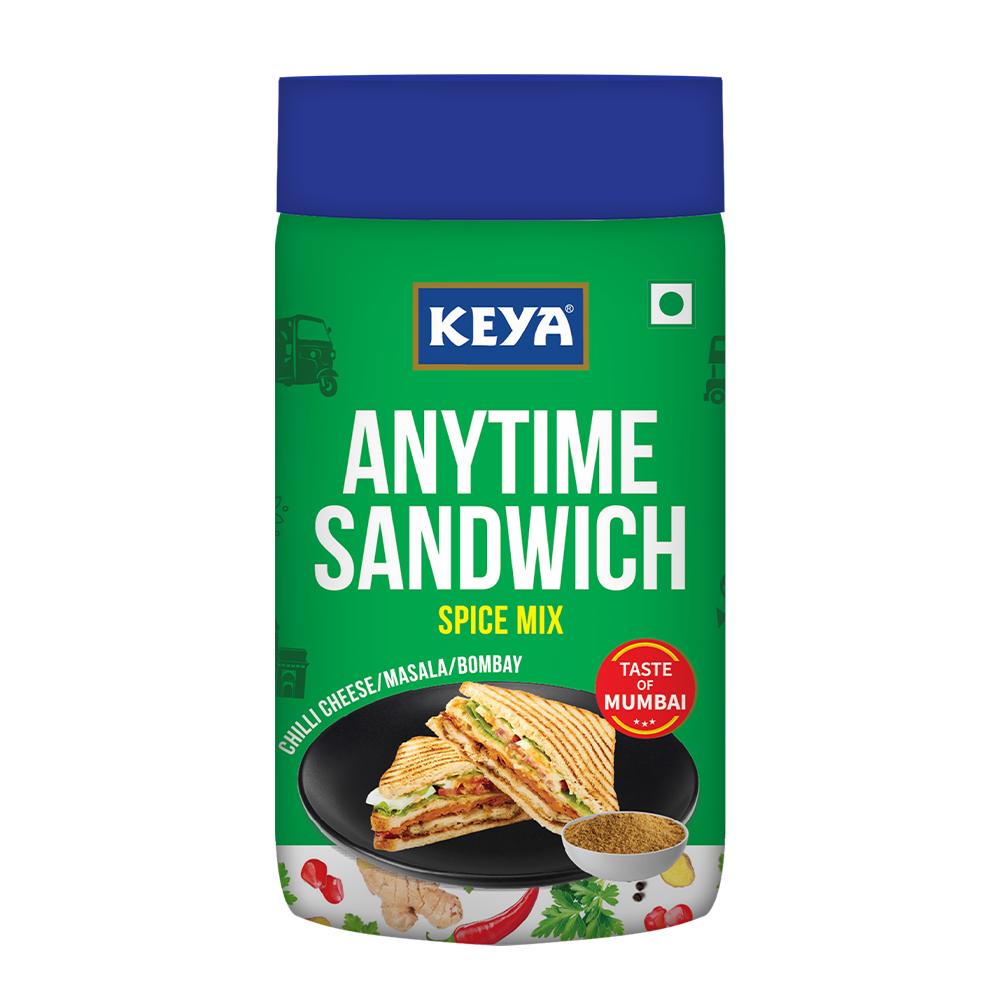 Keyafoods Keya Any Time Sandwich Spice Mix jar with a spoon, enhancing a delicious sandwich. - Image 2