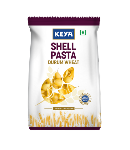 Keya 100 Durum Wheat Shell Pasta, showcasing its unique shell shape and golden color, ready for cooking. - Image 2