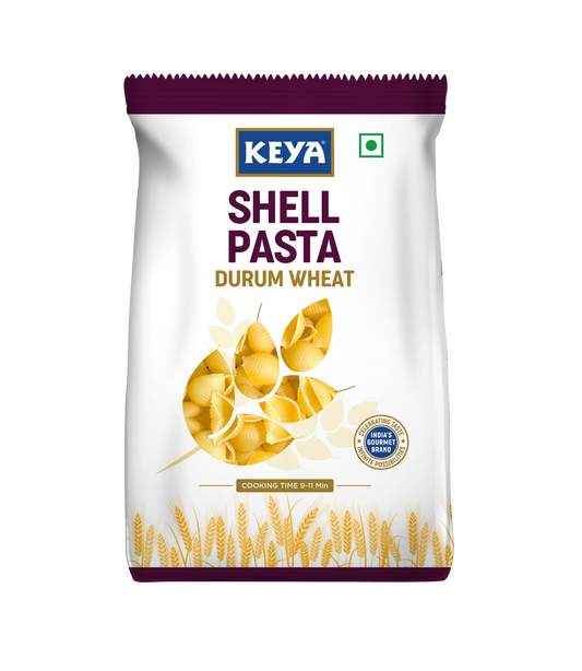 Keya 100 Durum Wheat Shell Pasta, showcasing its unique shell shape and golden color, ready for cooking. - Image 2