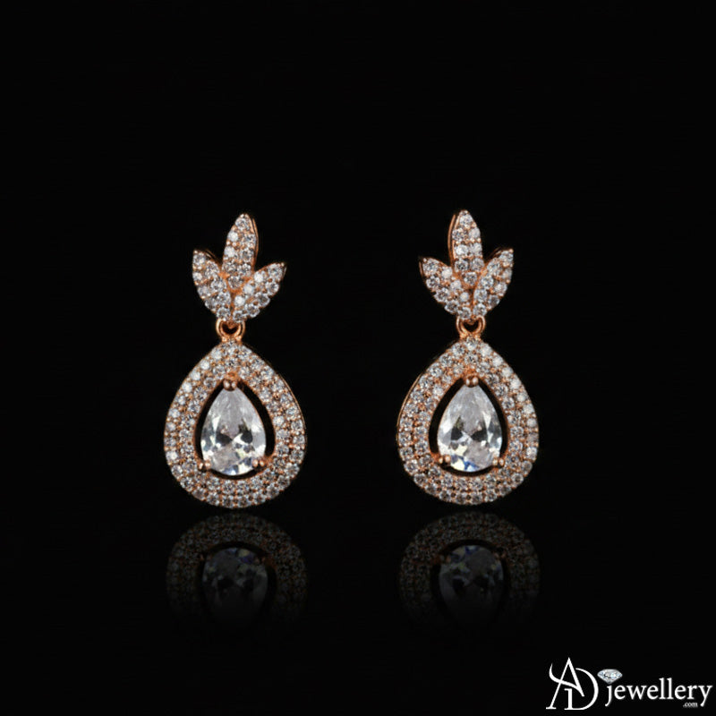 Full view of the rose-gold toned necklace and earring set