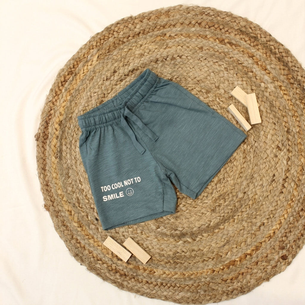Full outfit showing t-shirt and shorts on a baby model