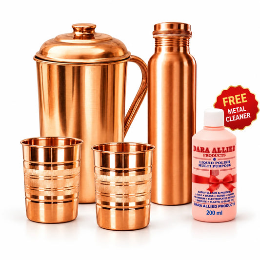 Copper jug bottle and two glasses with the free metal polish