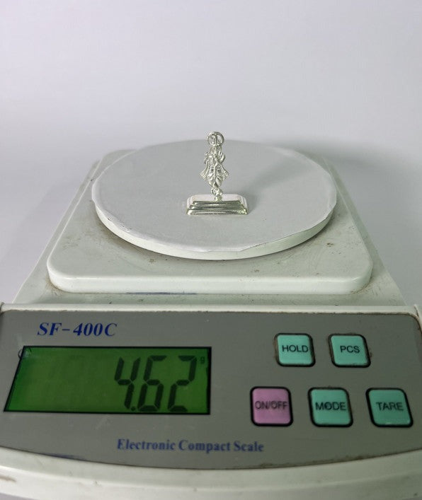 Silver Krishna idol