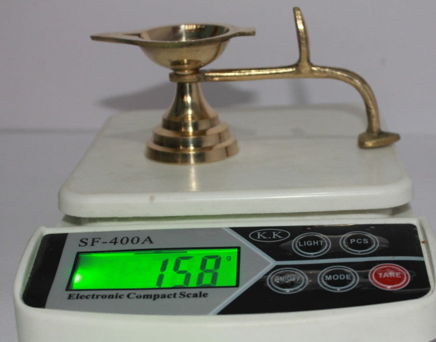 Brass Table Diya Deepak With Handle 158gm - PUSHMYCART